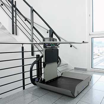 Artira inclined platform lift on a curved stairway