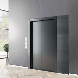 LULA limited-use/limited-application elevator with sleek black stainless steel doors