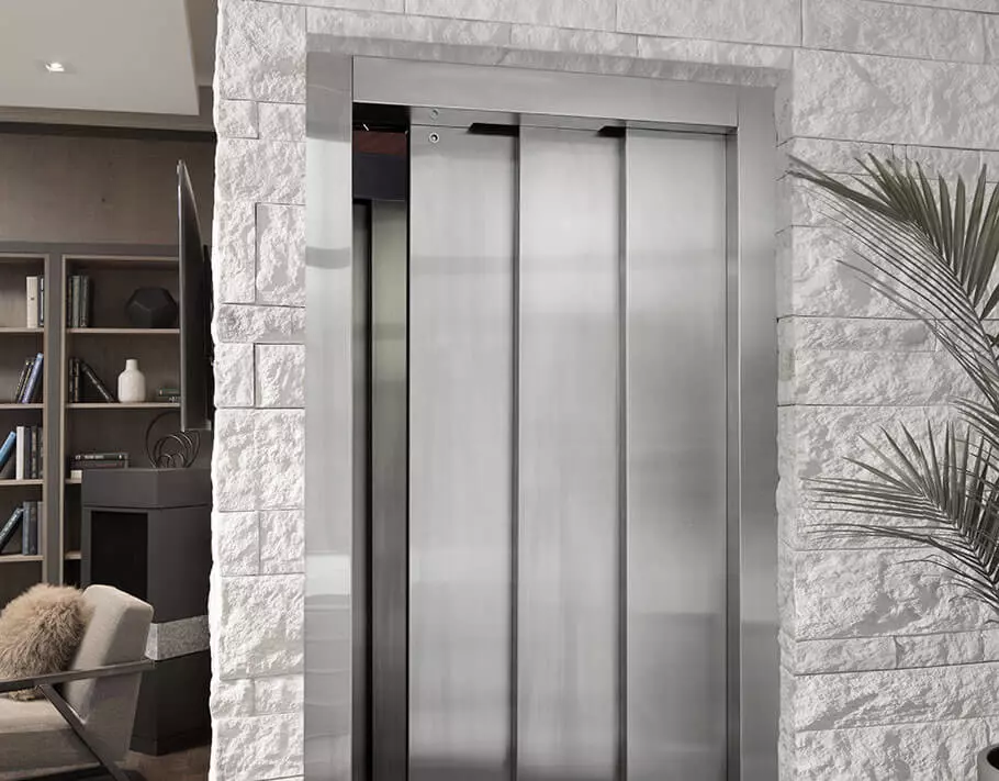 Elvoron home elevator with three speed doors slightly ajar in modern home