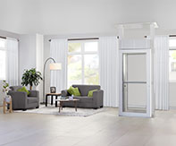 LUMA Homelift installed in a bright modern living room with light wood floors and contemporary furniture