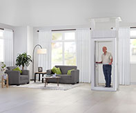 Woman entering the LUMA Homelift in a stylish living room, showcasing its compact and elegant design