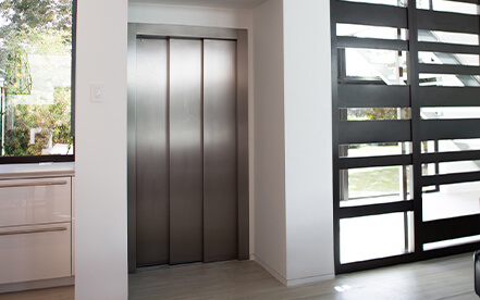Home elevator with a custom interior leads to an outdoor rooftop patio