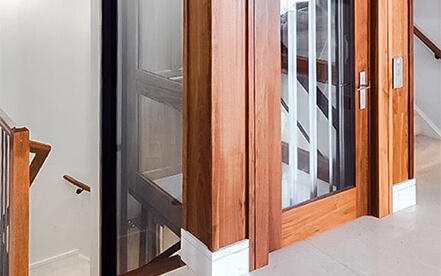 Home Elevator with swinging hall door showing interior of the cab