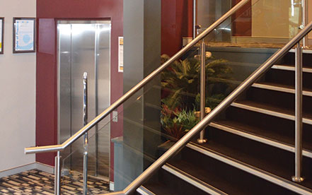 Home Elevator with swinging hall doors used for accessibility needs